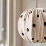 Bild in Gallery-Viewer laden, Close view of cream fabric pleats and black polka dots