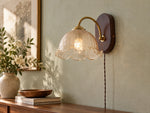 Load image into Gallery viewer, Scalloped Glass and Walnut Plug-In Wall Sconce in a changed-background room scene