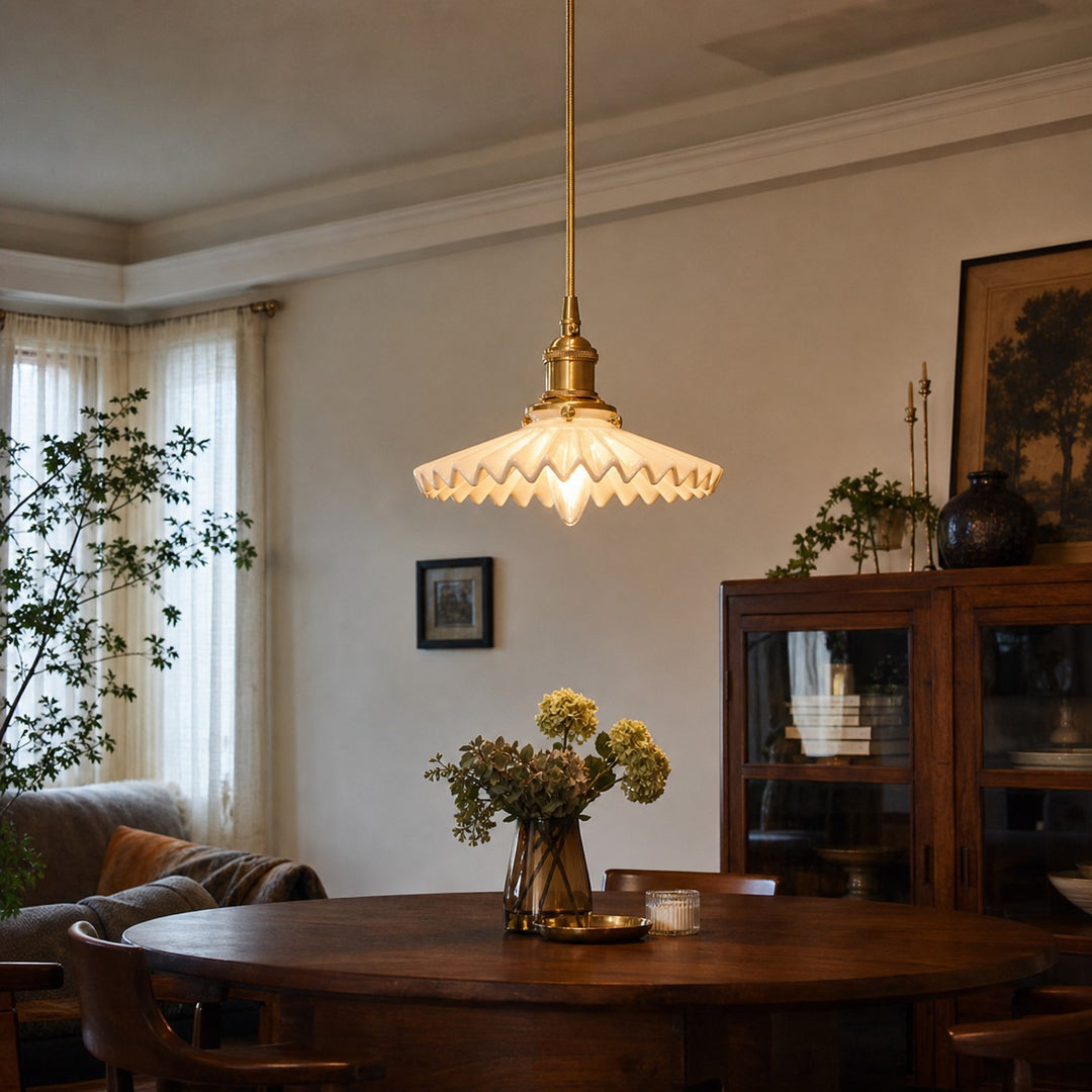 White ceramic pendant light over a dining table