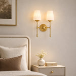 Cargar imagen en el visor de la Galería, Vintage brass wall light creating a warm bedroom atmosphere