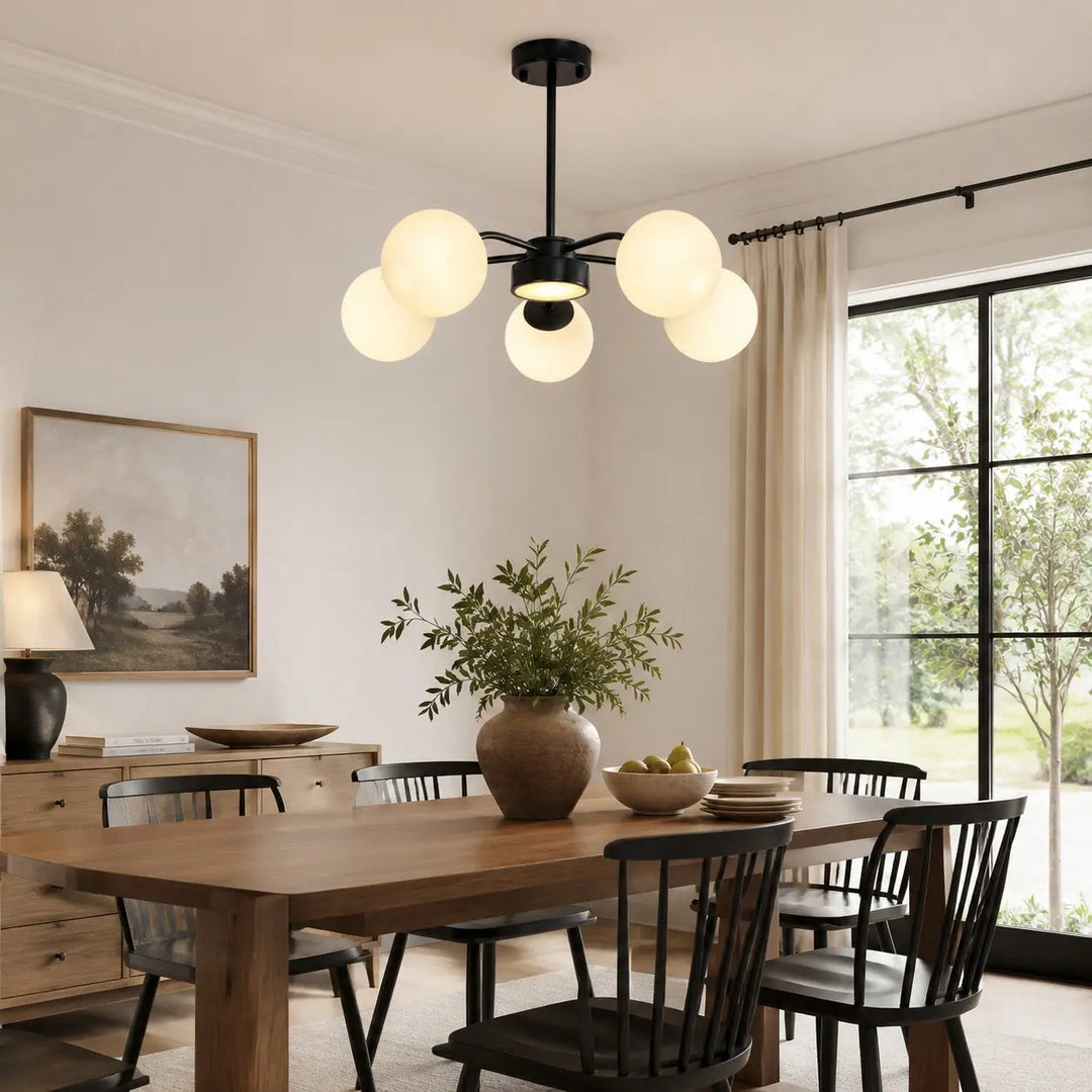 Black five-light chandelier above a dining table