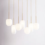 Load image into Gallery viewer, Lumivelle Sculptural 7-Light Chandelier – Adjustable Height Modern Glass Pendant
