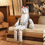 Cargar imagen en el visor de la Galería, Hand-carved wooden cat ornament styled on a tabletop edge