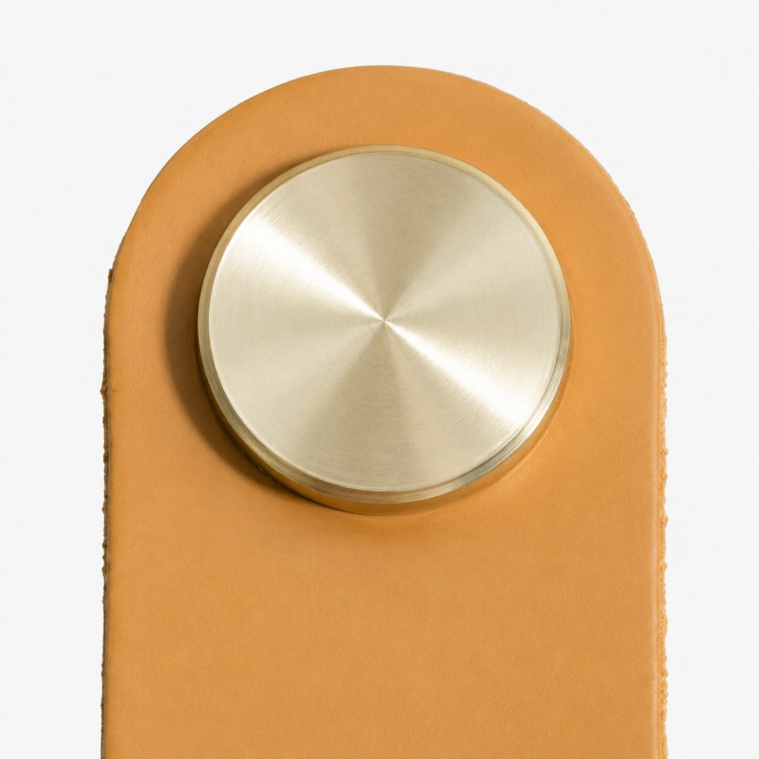 Cowhide leather and brass cabinet pull handle detail and lifestyle image