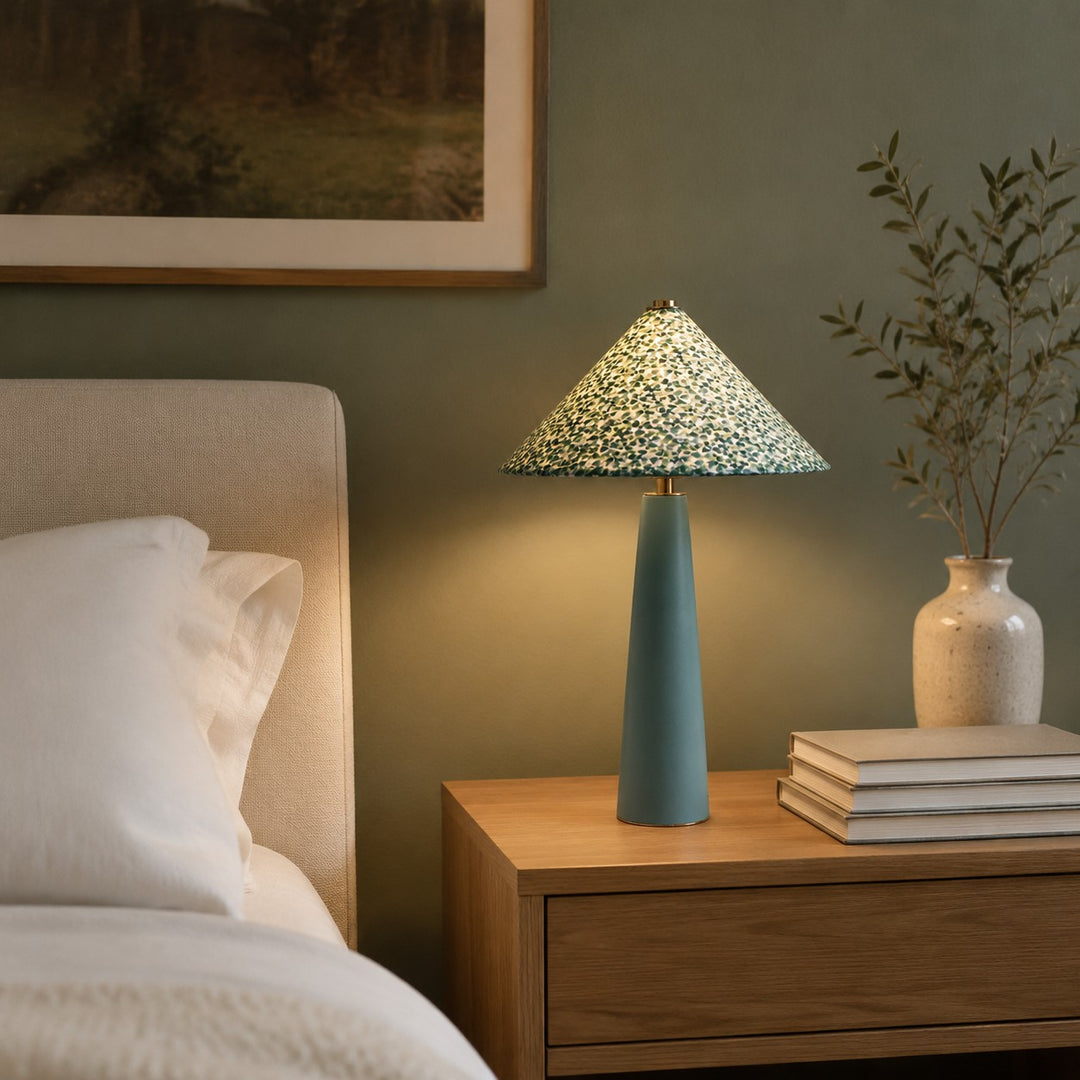 Floral ceramic table lamp on a bedside table