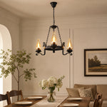 Charger l'image dans la visionneuse de galerie, Three-light hurricane glass chandelier above a warm dining table