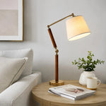 Cargar imagen en el visor de la Galería, Warm fabric shade table lamp on a living room side table