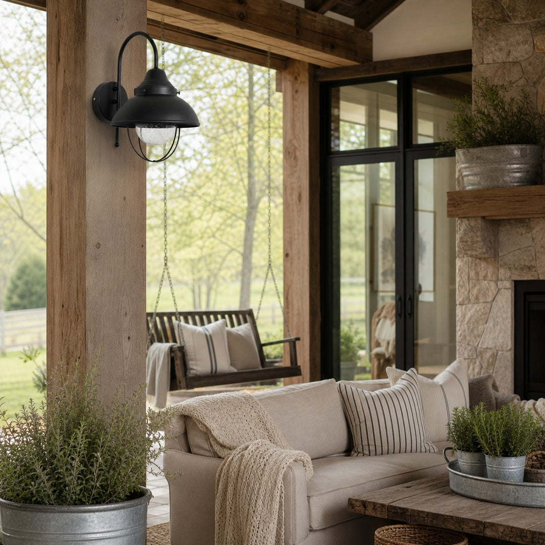 Black seeded-glass wall lamp styled in a quiet living space