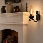 Bild in Gallery-Viewer laden, Kerosene style wall lamp glowing beside a fireplace mantel