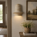 Charger l'image dans la visionneuse de galerie, Travertine wall sconce glowing beside artwork and a console vignette