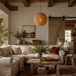 Charger l'image dans la visionneuse de galerie, Caramel woven globe pendant displayed in a rustic living room