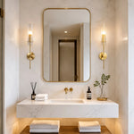 Cargar imagen en el visor de la Galería, Copper alabaster wall sconces installed beside a bathroom mirror