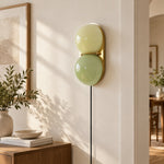 Charger l'image dans la visionneuse de galerie, Two globe glass wall sconce by a window