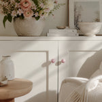Load image into Gallery viewer, Blush pink cabinet knobs on a styled cabinet
