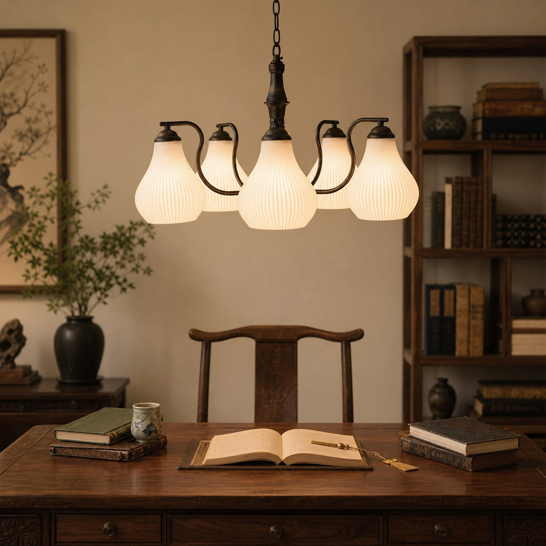 Vintage chandelier above a study desk with ribbed glass shades