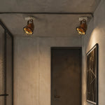Load image into Gallery viewer, Rust ceiling spotlight installed in an industrial hallway