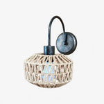 Bild in Gallery-Viewer laden, Shade B woven rattan wall sconce in antique brass