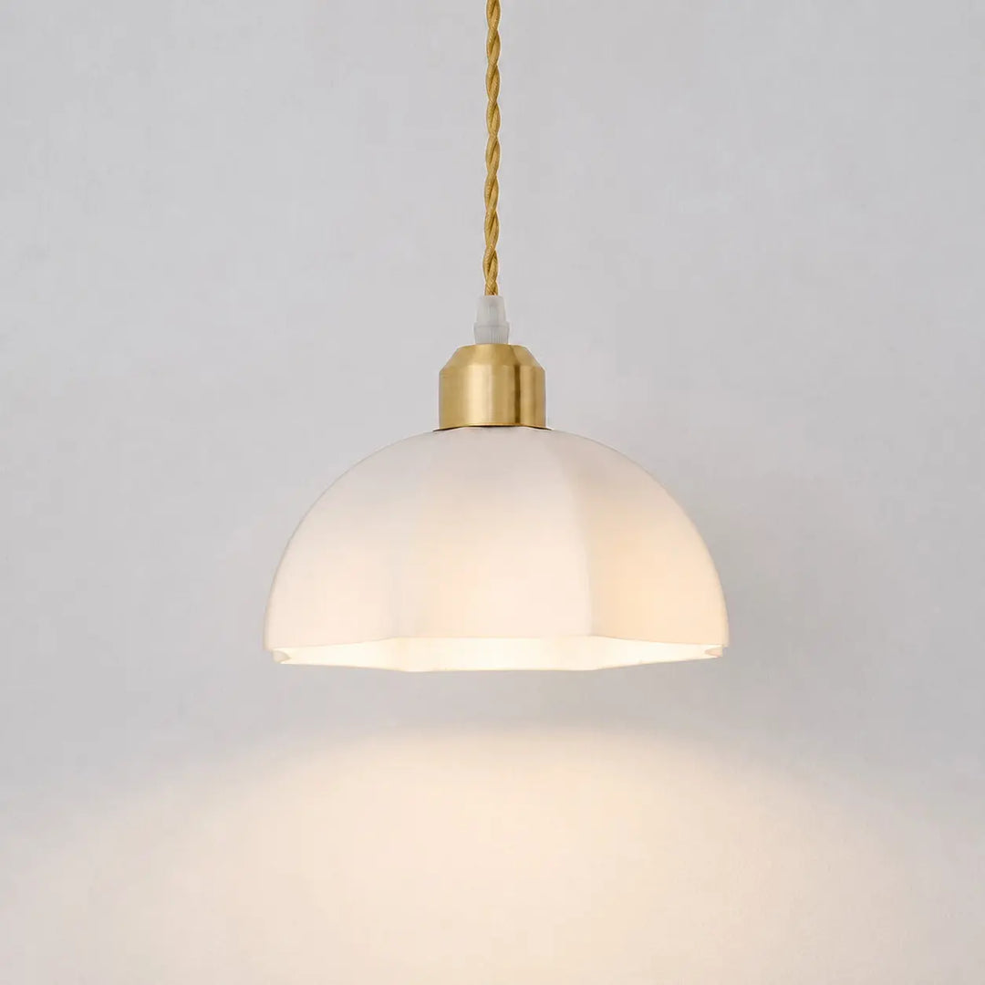 Milk glass pendant light in an illuminated room