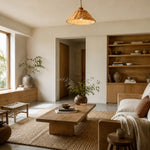 Charger l'image dans la visionneuse de galerie, Woven rattan pendant lamp above a warm neutral lounge area