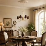 Bild in Gallery-Viewer laden, Brown-shade chandelier suspended in a warm traditional dining room
