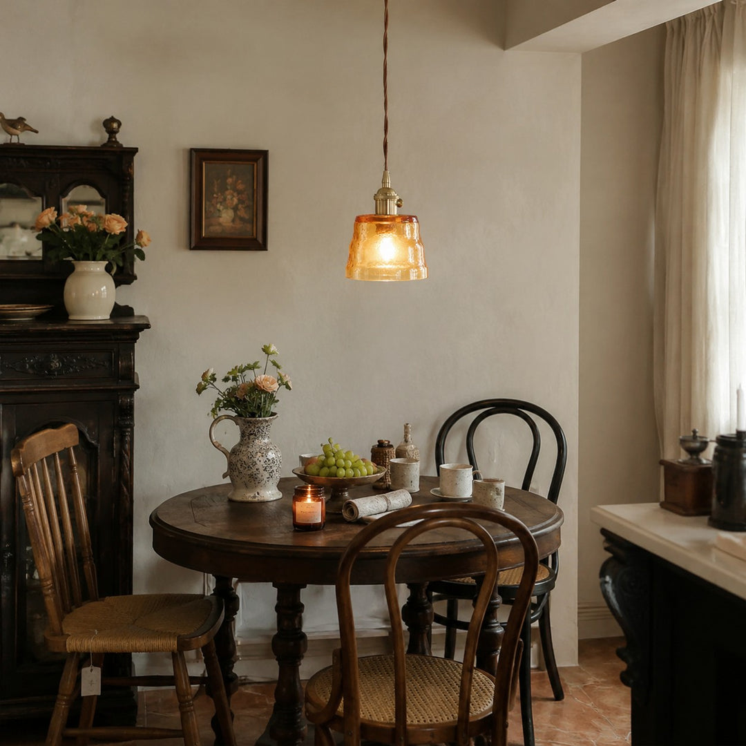 Amber glass pendant light in a vintage dining room