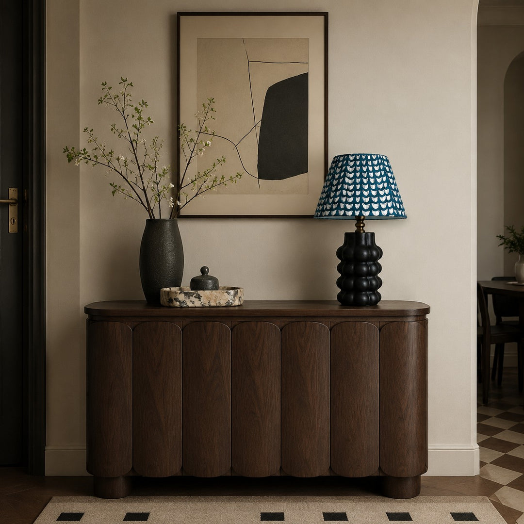 Sculptural ceramic table lamp styled on an entryway console