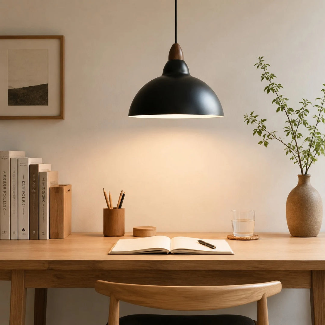 black pendant light above a desk reading area
