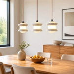 Cargar imagen en el visor de la Galería, Three-light travertine stone pendant installed above a dining table
