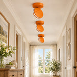 Charger l'image dans la visionneuse de galerie, Three orange SPECTRA lights in a hallway