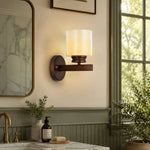 Cargar imagen en el visor de la Galería, Aged bronze wall sconce installed beside a bathroom mirror