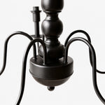 Load image into Gallery viewer, Close view of the black curved chandelier arms and central body