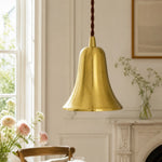 Load image into Gallery viewer, Natural brass bell pendant light in a bright dining room