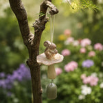 Cargar imagen en el visor de la Galería, Warm ivory squirrel wind chime hanging in a garden setting