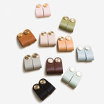 Load image into Gallery viewer, Cowhide leather and brass cabinet pull handle detail and lifestyle image