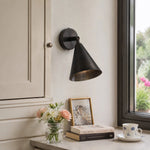 Load image into Gallery viewer, Matte black brass wall light beside a window and console