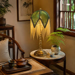 Bild in Gallery-Viewer laden, Vintage green tassel table lamp in a tea room