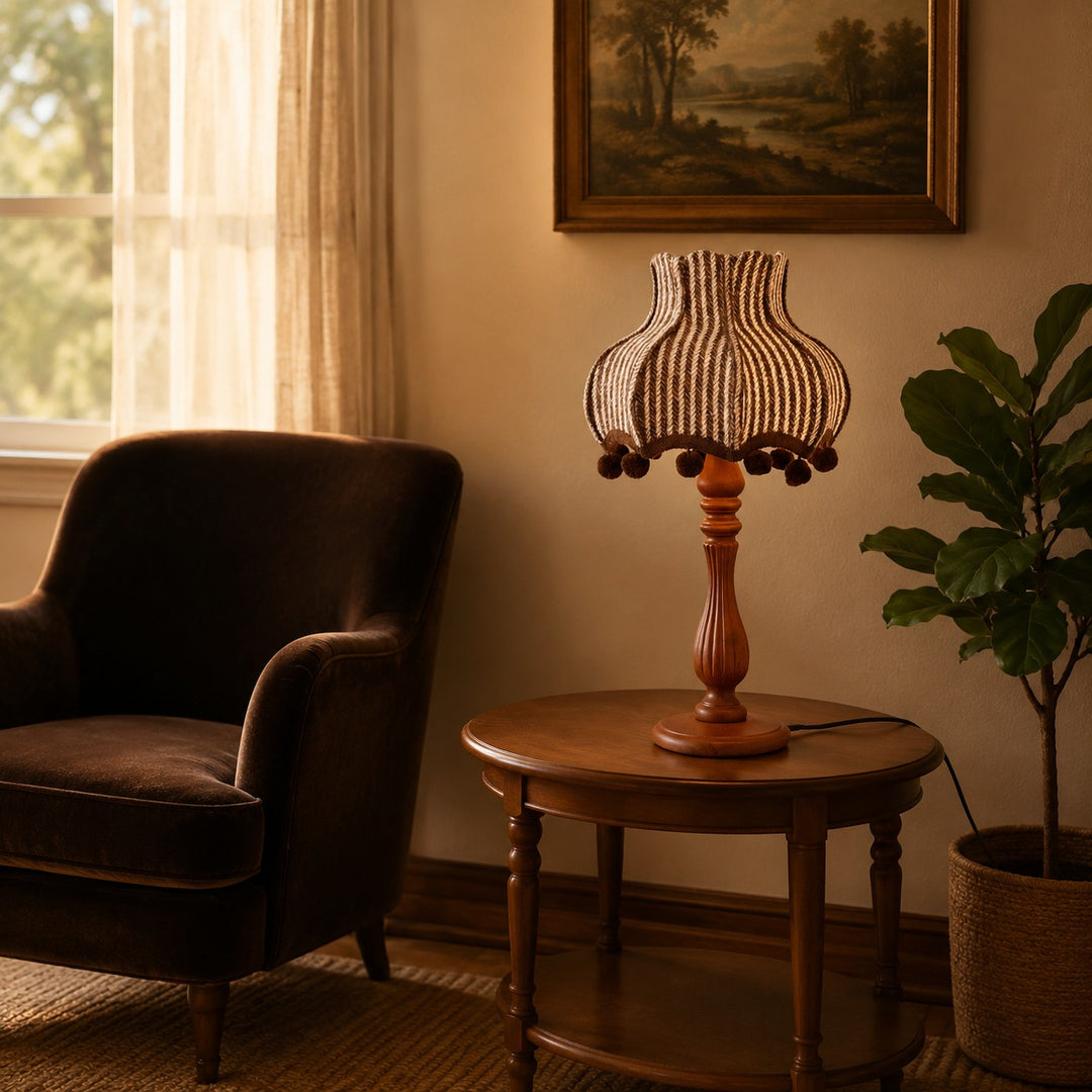 Vintage striped fabric table lamp beside a lounge chair