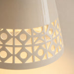 Bild in Gallery-Viewer laden, close view of cutout ceramic shade edge and warm glow