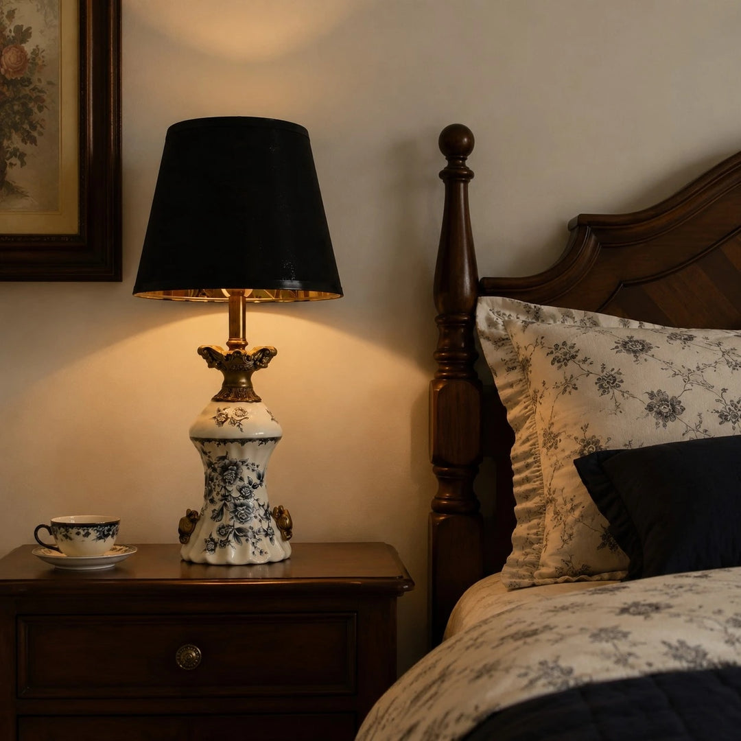 Blue porcelain motif table lamp beside a wooden bed