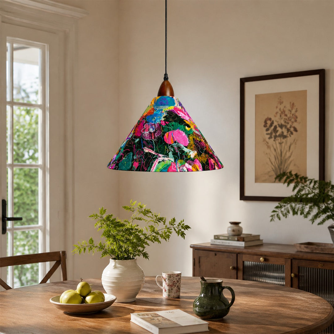 Painted floral pendant above rustic oval dining table with green plants