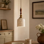 Cargar imagen en el visor de la Galería, Wood accent floral ceramic pendant light above a table