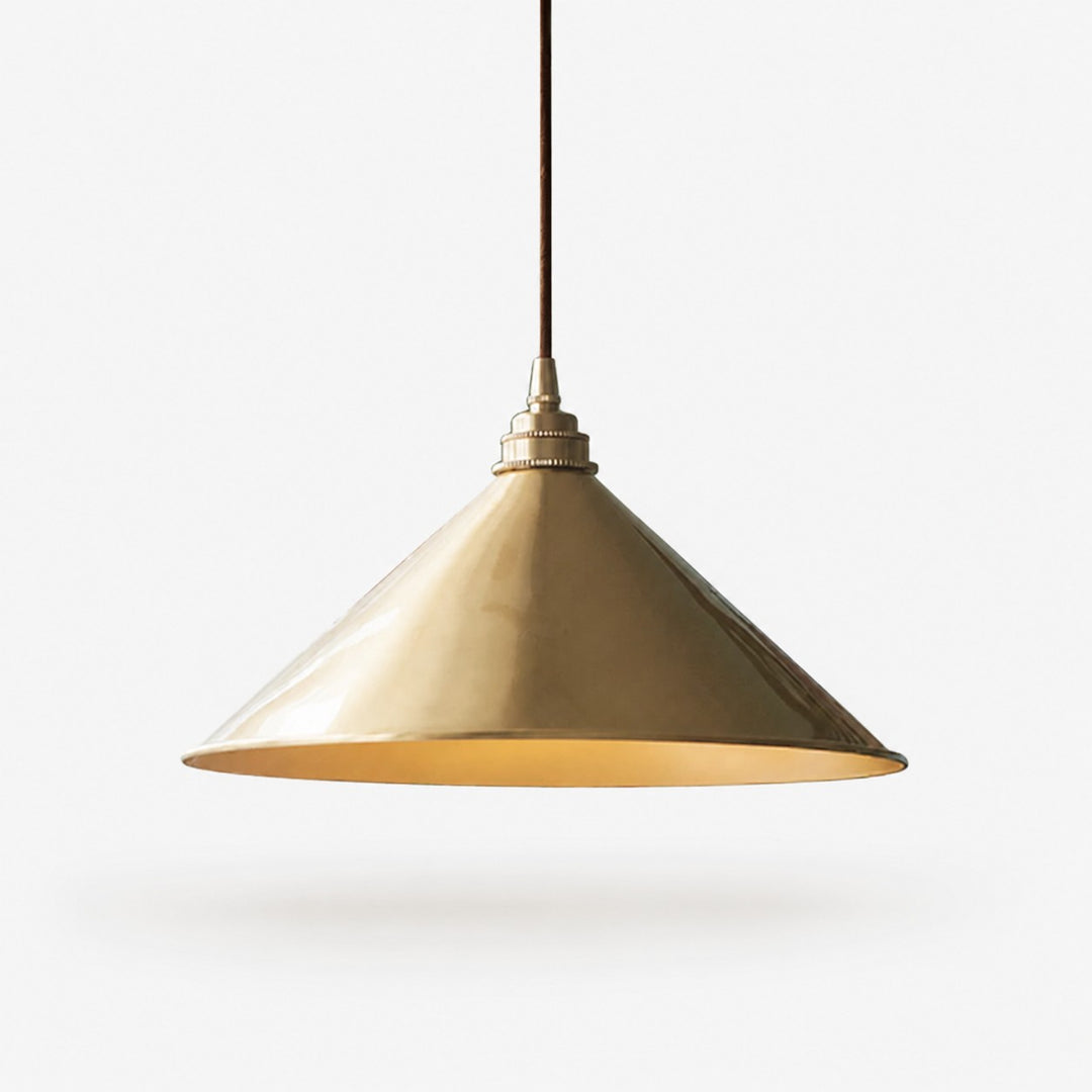 Bell shade copper pendant light on a white background