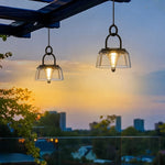 Load image into Gallery viewer, Pair of solar lanterns hanging on a balcony at dusk