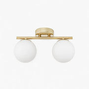Gold two-light ceiling light with milk glass shades