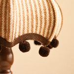 Bild in Gallery-Viewer laden, Close detail of the plush plaid fabric shade and pom pom fringe