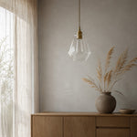 Cargar imagen en el visor de la Galería, Clear faceted glass pendant light styled beside a curtain and cabinet