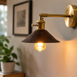 Load image into Gallery viewer, Wood and brass wall sconce beside an indoor plant