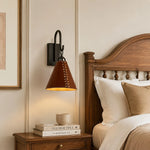Cargar imagen en el visor de la Galería, Black and red leather wall sconce installed above a bedside table in a warm bedroom