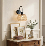 Bild in Gallery-Viewer laden, Woven rattan wall sconce above a styled console