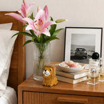 Load image into Gallery viewer, Small wooden lion figurine styled on a bedside table